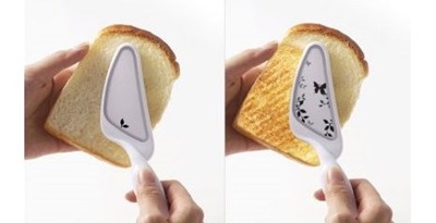 handheld portable toaster ubergizmo.com