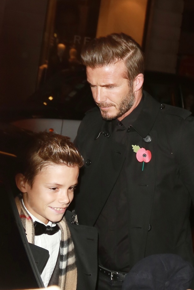Launch of the 2014 Burberry festive campaign - Outside Arrivals Featuring: Romeo Beckham,David Beckham Where: London, United Kingdom When: 03 Nov 2014 Credit: WENN.com