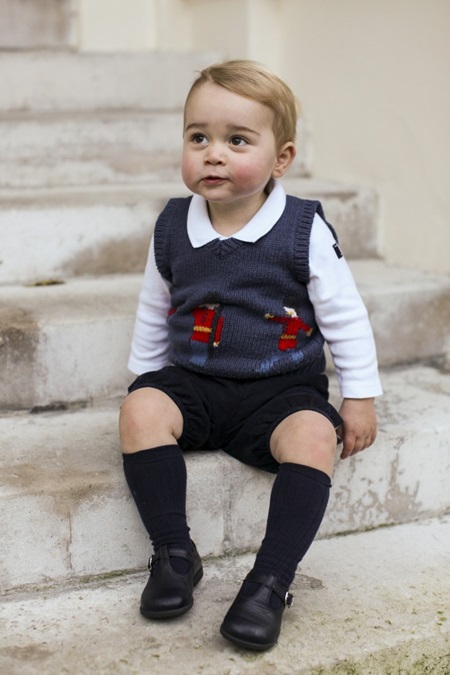 EDITORIAL USE ONLY. NO COMMERCIAL USE Undated handout photo issued by the Duke and Duchess of Cambridge, taken in late November of one of the three official Christmas images showing Prince George in a courtyard at Kensington Palace, central London.