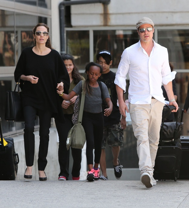 51450947 Couple Angelina Jolie, Brad Pitt and their kids Zahara and Maddox arriving on a flight at LAX airport in Los Angeles, California on June 14, 2014. The family was returning from a trip in London where they attended a rape summit. FameFlynet, Inc - Beverly Hills, CA, USA - +1 (818) 307-4813