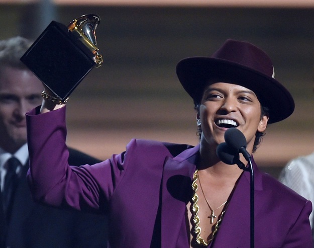 Feb 15, 2016; Los Angeles, CA, USA; Bruno Mars accepts Record of the Year for Uptown Funk during the 58th Grammy Awards at the Staples Center. Mandatory Credit: Robert Hanashiro-USA TODAY NETWORK *** Please Use Credit from Credit Field ***