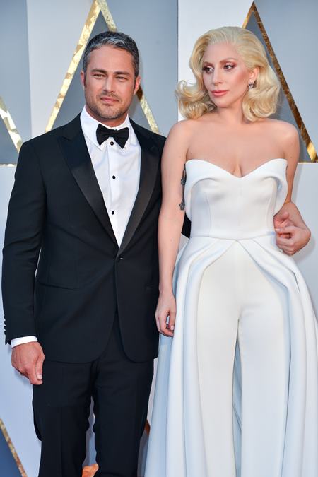 Taylor Kinney and Lady Gaga arriving at the 88th Academy Awards Ceremony held at the Dolby Theatre in Hollywood, California on February 28, 2016. (Photo by Sthanlee B. Mirador) *** Please Use Credit from Credit Field ***