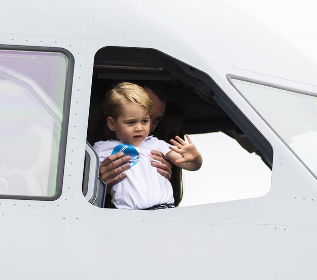 Mandatory Credit: Photo by David Hartley/REX/Shutterstock (5753599al) Prince George sits in the cockpit of a Royal Australian Air Force plane. Royal International Air Tattoo, Fairford, UK - 08 Jul 2016