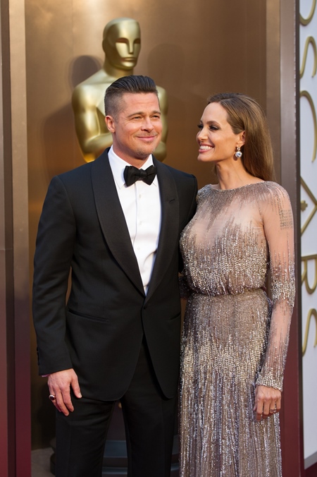 Oscar®-nominated for Best Picture, Brad Pitt arrives with Angelina Jolie for the live ABC Telecast of The 86th Oscars® at the Dolby® Theatre on March 2, 2014 in Hollywood, CA.