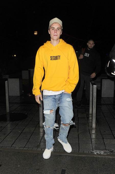 Justin Bieber decided to take the scenic route back to his hotel after performing at London's O2 Arena as part of his 'Purpose' tour. Instead of driving back, the singer was taken on a small boat down the River Thames and dropped off at a pier on the Embankment where his cars collected him. Bieber was wearing a mustard coloured hoodie with the word "Security" written on it, which is part of his tour merchandise. Ironically he then demanded his actual security stop blocking the snappers and let them take picture of the popstar. He and a group of friends then headed to Sushi Samba for a late dinner. Featuring: Justin Bieber Where: London, United Kingdom When: 12 Oct 2016 Credit: Will Alexander/WENN.com