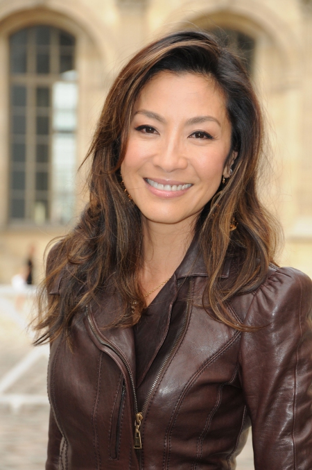 PARIS - OCTOBER 07: Michelle Yeoh poses as she arrives for the Louis Vuitton Pret a Porter show as part of the Paris Womenswear Fashion Week Spring/Summer 2010 at Cour Carree du Louvre on October 7, 2009 in Paris, France. (Photo by Pascal Le Segretain/Getty Images)