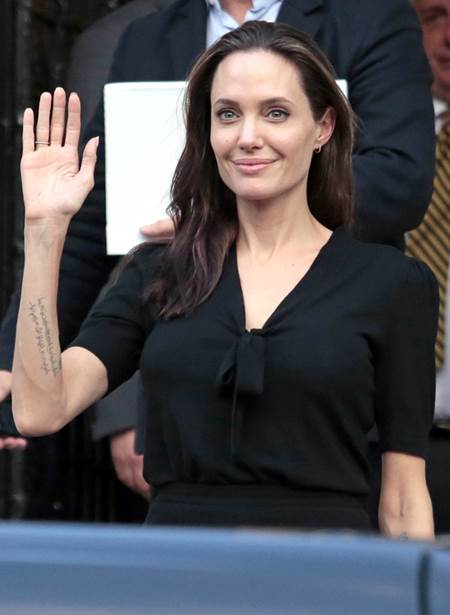 ATHENS, GREECE- MARCH 16: Special envoy of the United Nations High Commissioner for Refugees Angelina Jolie leaving the Greek Prime minister's office after a meeting with Greek Prime Minister Alexis Tsiprasin on March 16, 2016 in Athens, Greece. (Photo by Milos Bicanski/Getty Images)