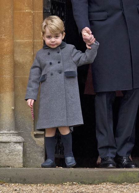 Mandatory Credit: Photo by REX/Shutterstock (7666247h) Prince George after the service with a candy cane sweet Christmas Day church service, Englefield, UK - 25 Dec 2016