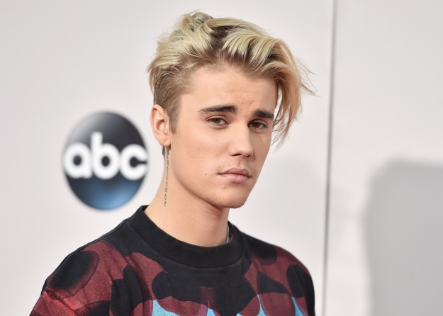 FILE - In this Sunday, Nov. 22, 2015 file photo, Justin Bieber arrives at the American Music Awards at the Microsoft Theater in Los Angeles. With his recent batch of hit singles and semi-grown-up sound  - including the electro-pop "Where Are U Now" with DJ-producers Skrillex and Diplo - adult men have begun attending the church of Bieber, and while some have issues admitting it, other proudly say they are Beliebers. Sorry and What Do You Mean, currently at Nos. 2 and 4 on Billboards Hot 100 chart, helped Bieber solidify his comeback after years of a broken image, which included arrests, public smoking and fainting onstage that led to hospitalization. (Photo by Jordan Strauss/Invision/AP, File)